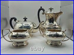 A silver plated three piece tea set together with a similar plated coffee pot