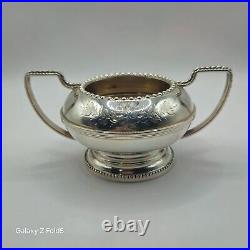 A silver plated three piece tea set together with a similar plated coffee pot