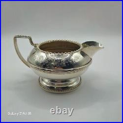 A silver plated three piece tea set together with a similar plated coffee pot