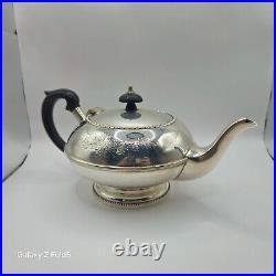 A silver plated three piece tea set together with a similar plated coffee pot