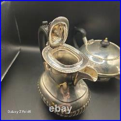 A silver plated three piece tea set together with a similar plated coffee pot