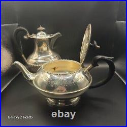 A silver plated three piece tea set together with a similar plated coffee pot