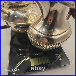 A silver plated three piece tea set together with a similar plated coffee pot