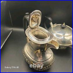 A silver plated three piece tea set together with a similar plated coffee pot