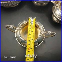 A silver plated three piece tea set together with a similar plated coffee pot