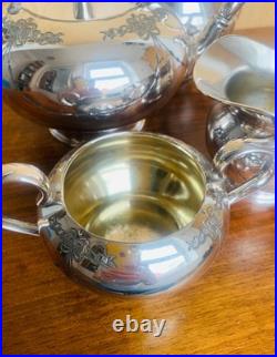 Edwardian Art Nouveau Silver Plate Four-Piece Tea Service by James Dixon &